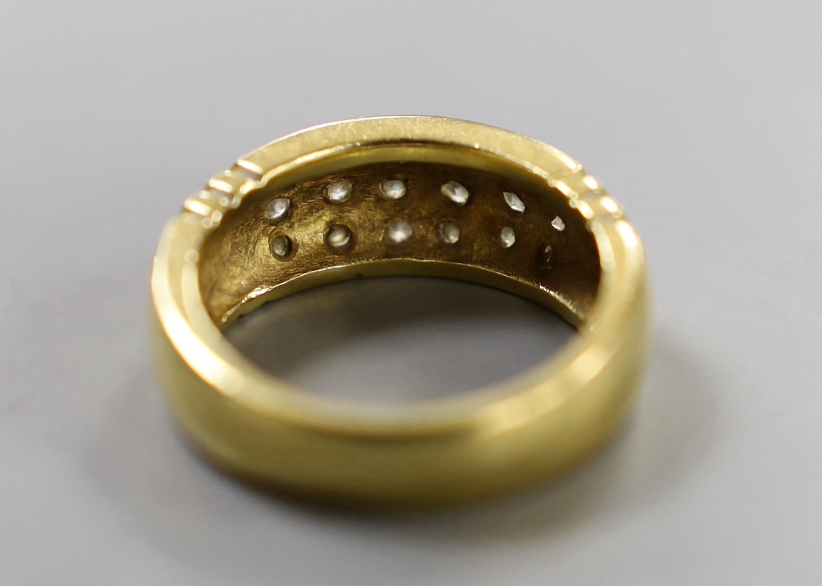 A yellow metal and eighteen stone pave set diamond ring, size Q/R